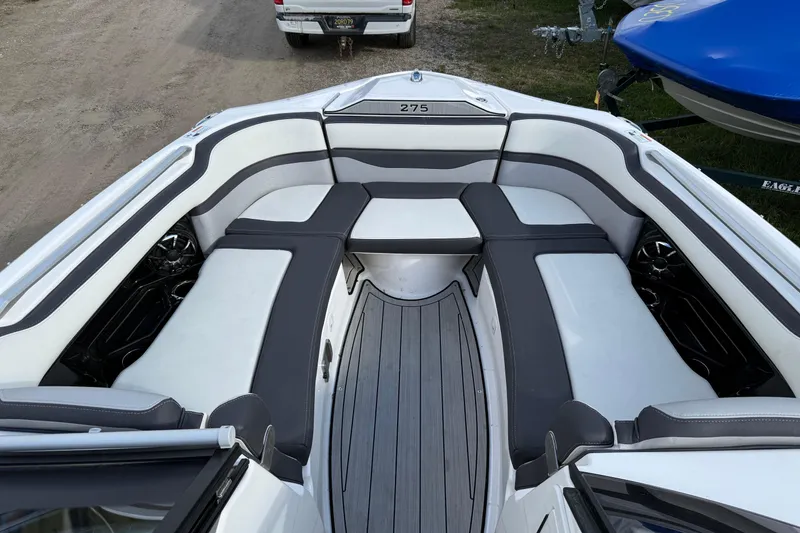 Slide: The Image of 2021 Yamaha Boats 275 E interior with sleek seating and modern design. - 4