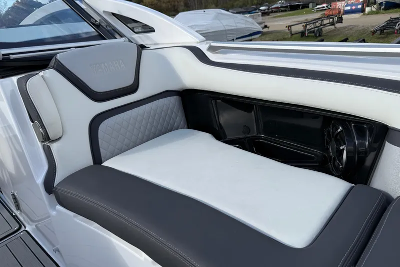 Slide: The Image of 2021 Yamaha Boats 275 E interior seating with sleek design and premium materials. - 5