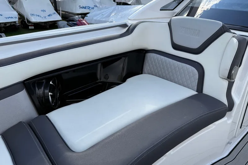 Slide: The Image of 2021 Yamaha Boats 275 E interior seating with sleek, modern design and premium upholstery. - 6