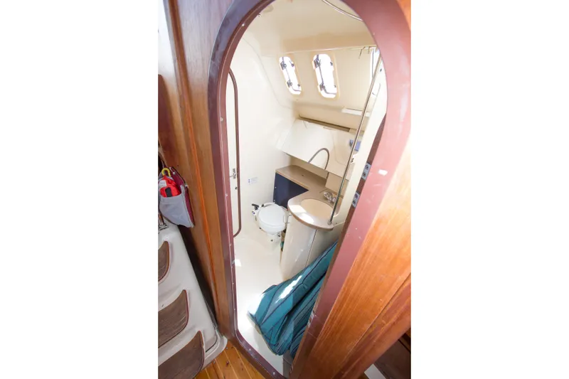 Slide: The Image of Interior view of 1997 Hunter 376 sailboat bathroom with sink and toilet. - 14