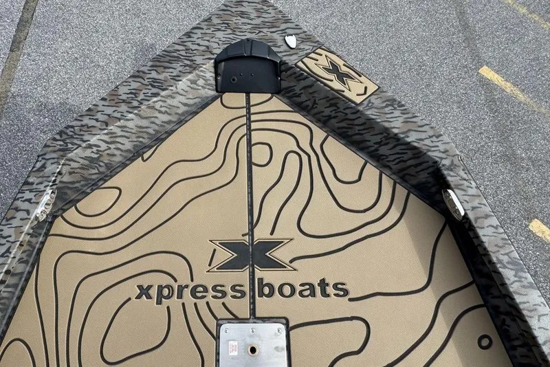 Slide: The Image of 2026 Xpress H22B Bay boat with camouflage design and logo on deck. - 20