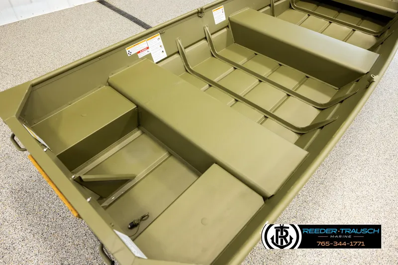 Slide: The Image of 2025 Lund 1240 boat interior with green finish, displayed at Reeder-Trausch Marine showroom. - 10