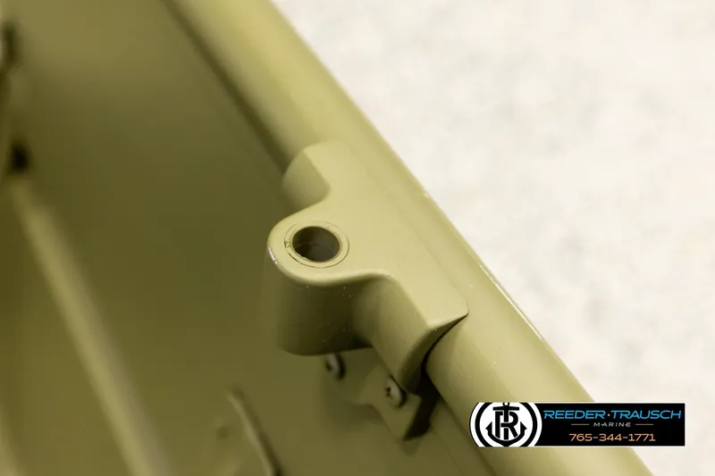 Slide: The Image of Close-up of 2025 Lund 1240 boat detail, featuring a beige metal component. - 17