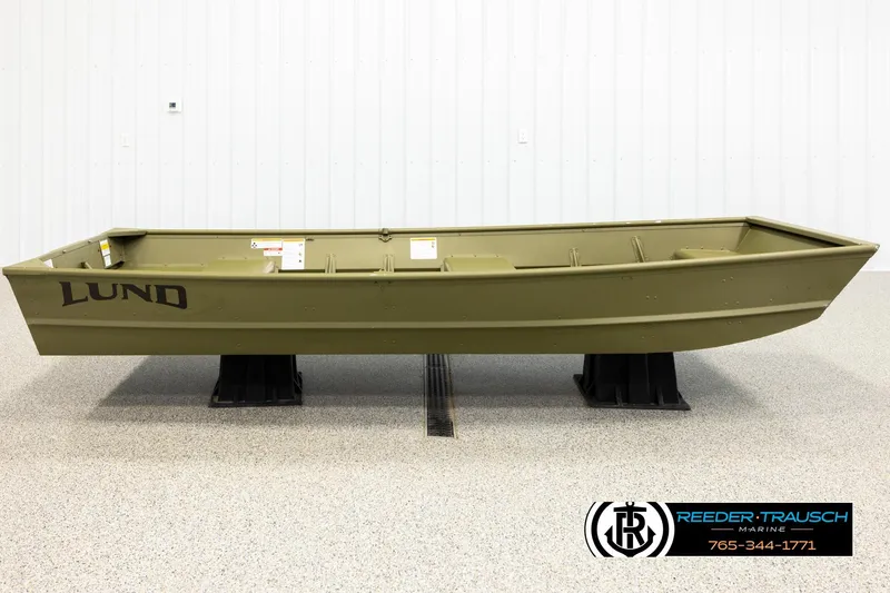 Slide: The Image of 2025 Lund 1240 boat in showroom, olive green, displayed on stands. - 3