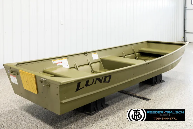 Slide: The Image of 2025 Lund 1240 boat displayed indoors on stands. - 4