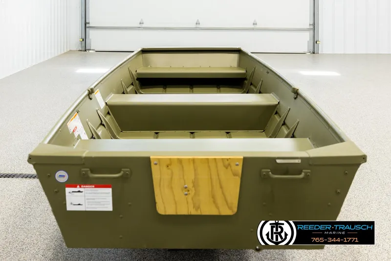 Slide: The Image of 2025 Lund 1240 boat in a showroom, featuring a durable, olive-green design. - 5