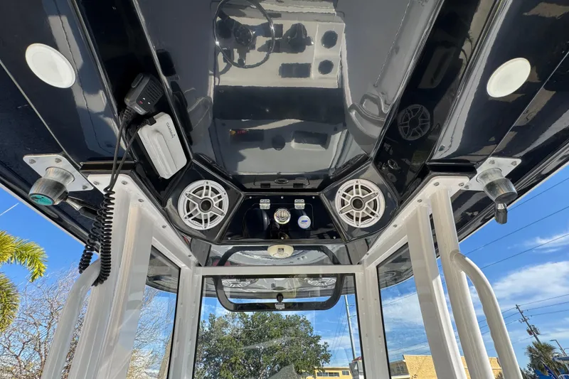Slide: The Image of 2022 Sportsman Open 232 Center Console boat interior with speakers and control panel. - 14