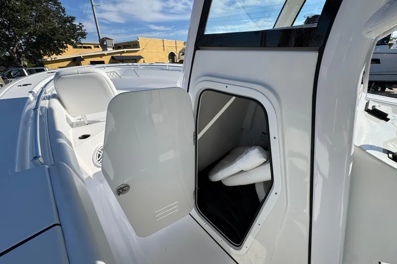 Slide: The Image of 2022 Sportsman Open 232 Center Console boat with open storage compartment. - 15
