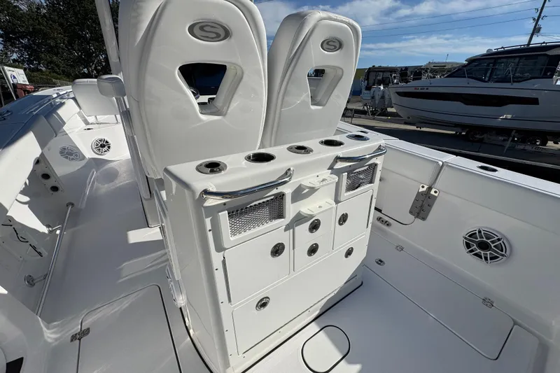 Slide: The Image of 2022 Sportsman Open 232 Center Console boat interior with seating and storage compartments. - 5
