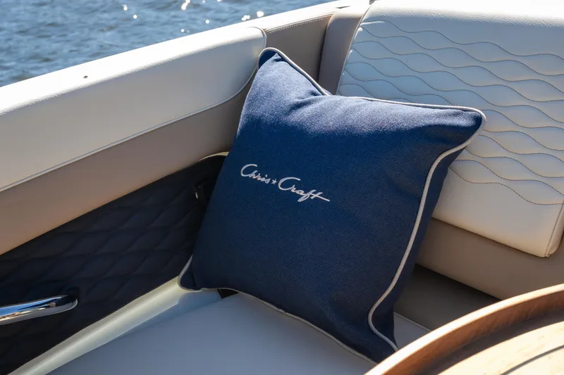 Slide: The Image of Luxurious interior of 2026 Chris-Craft Sportster 28 with branded blue cushion. - 11