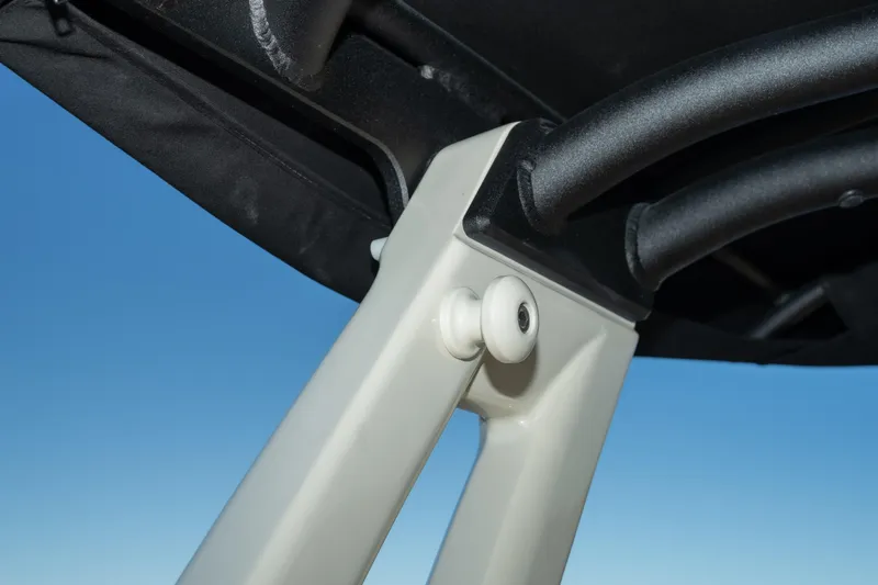 Slide: The Image of Close-up of 2026 Chris-Craft Sportster 28 boat canopy support against blue sky. - 18