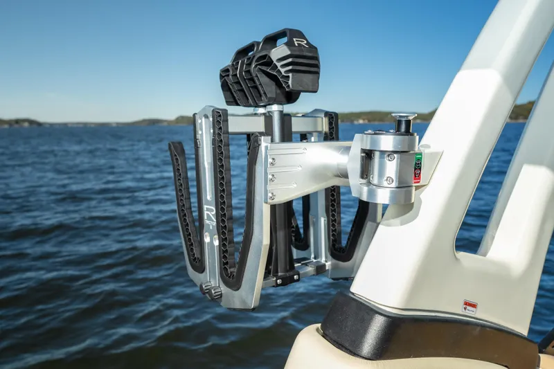 Slide: The Image of Chris-Craft Sportster 28 boat with a mounted wakeboard rack, 2026 model, on a sunny day. - 19