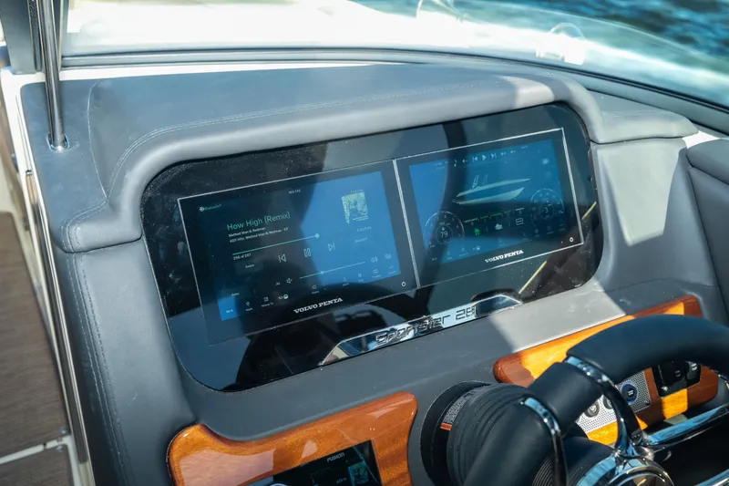 Slide: The Image of Dashboard of 2026 Chris-Craft Sportster 28 with dual digital displays and steering wheel. - 20