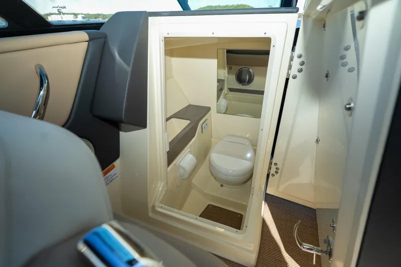 Slide: The Image of 2026 Chris-Craft Sportster 28 boat interior, featuring a compact bathroom with modern amenities. - 21