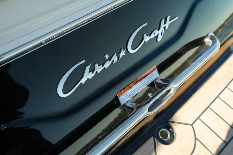 Slide: The Image of 2026 Chris-Craft Sportster 28 boat logo and warning label on deck. - 26