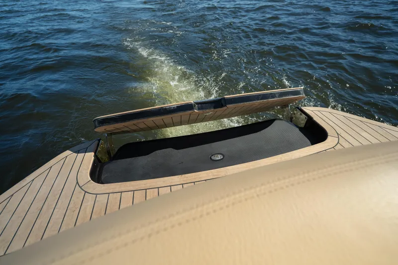 Slide: The Image of 2026 Chris-Craft Sportster 28 boat stern on water, showcasing elegant design and craftsmanship. - 27
