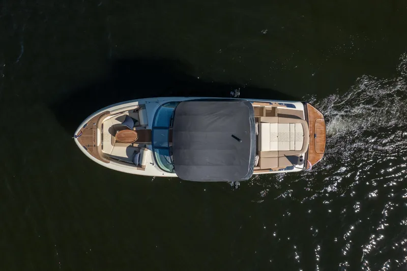 Slide: The Image of Overhead view of 2026 Chris-Craft Sportster 28 boat cruising on water. - 3