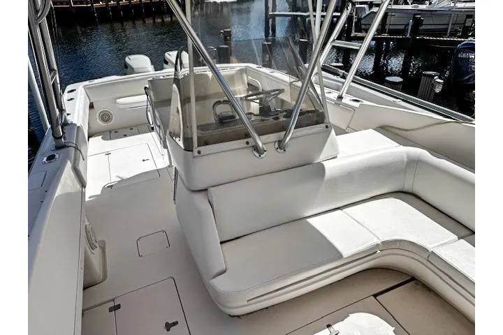 Slide: The Image of Cushioned storage seat on 1998 Intrepid 356 Cuddy boat interior. - 20