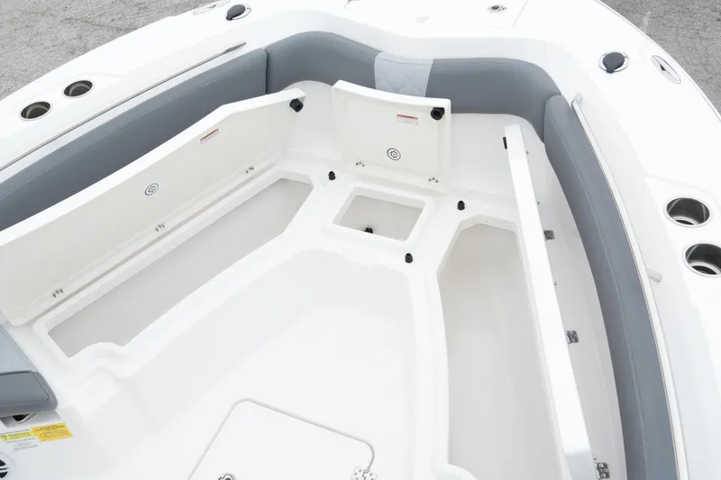 Slide: The Image of 2025 NauticStar 242 Offshore boat interior with seating and storage compartments. - 13