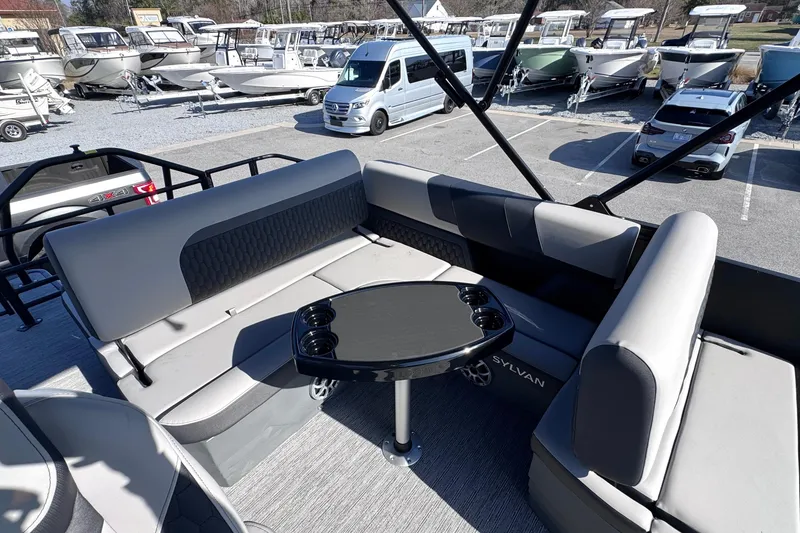 Slide: The Image of Luxurious seating area on 2026 Sylvan L3 CLZ boat, featuring sleek design and cup holders. - 13