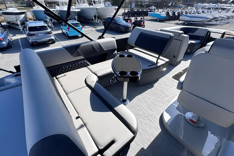 Slide: The Image of Luxurious seating area on 2026 Sylvan L3 CLZ boat, featuring modern design and cup holders. - 15