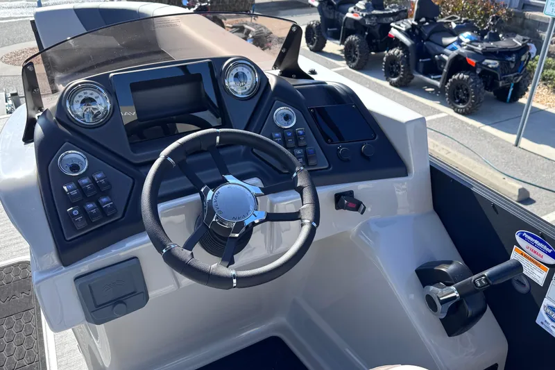 Slide: The Image of Steering console of 2026 Sylvan L3 CLZ boat with modern controls and dashboard. - 18