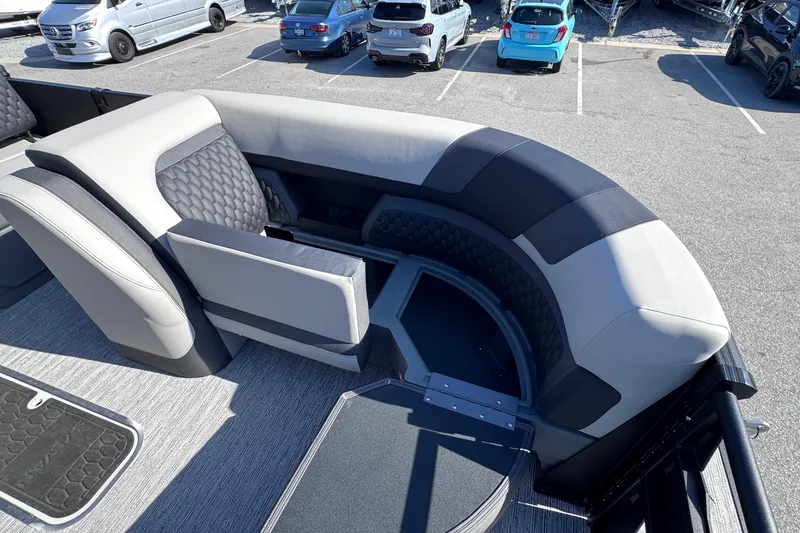 Slide: The Image of Luxurious seating on 2026 Sylvan L3 CLZ pontoon boat, parked in a lot. - 23