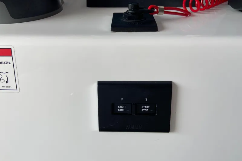 Slide: The Image of Control panel of 2026 Sportsman Heritage 261 Center Console with start/stop buttons. - 27