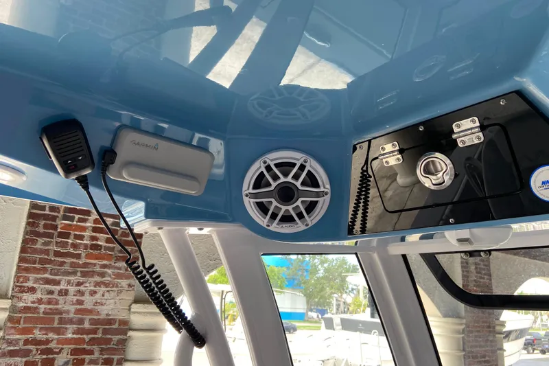Slide: The Image of Interior view of 2026 Sportsman Heritage 261 Center Console with speaker and communication equipment. - 28