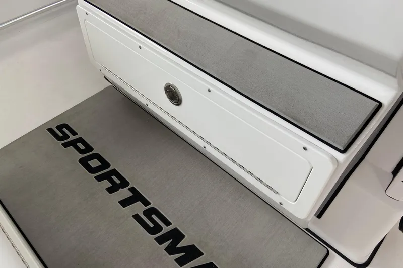 Slide: The Image of 2026 Sportsman Heritage 261 Center Console interior with branded flooring and storage compartment. - 29