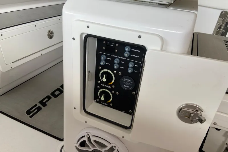 Slide: The Image of Control panel of 2026 Sportsman Heritage 261 Center Console boat, featuring various switches and dials. - 32