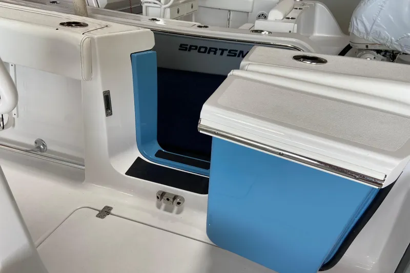 Slide: The Image of 2026 Sportsman Heritage 261 Center Console interior with blue and white seating. - 36