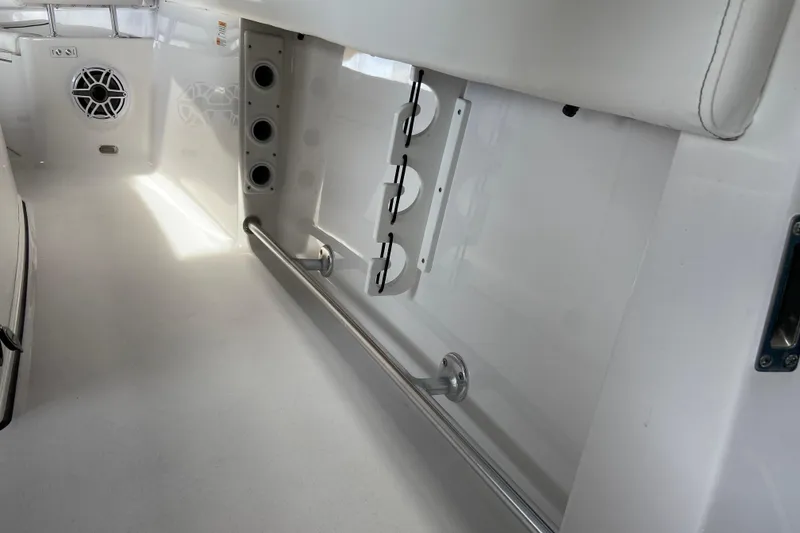 Slide: The Image of Interior view of 2026 Sportsman Heritage 261 Center Console boat, featuring sleek white design. - 39