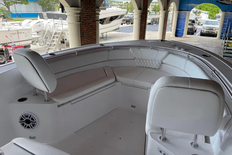 Slide: The Image of 2026 Sportsman Heritage 261 Center Console boat interior with white seating and modern design. - 41