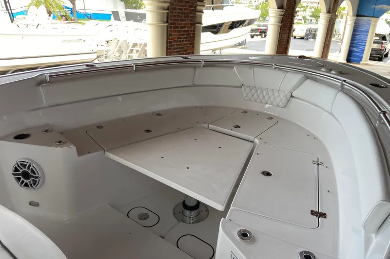 Slide: The Image of 2026 Sportsman Heritage 261 Center Console boat interior with seating and storage compartments. - 44