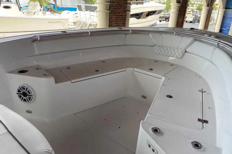 Slide: The Image of 2026 Sportsman Heritage 261 Center Console boat interior with seating and storage compartments. - 45