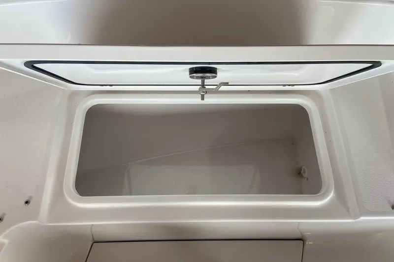 Slide: The Image of Open storage compartment on 2026 Sportsman Heritage 261 Center Console boat. - 48