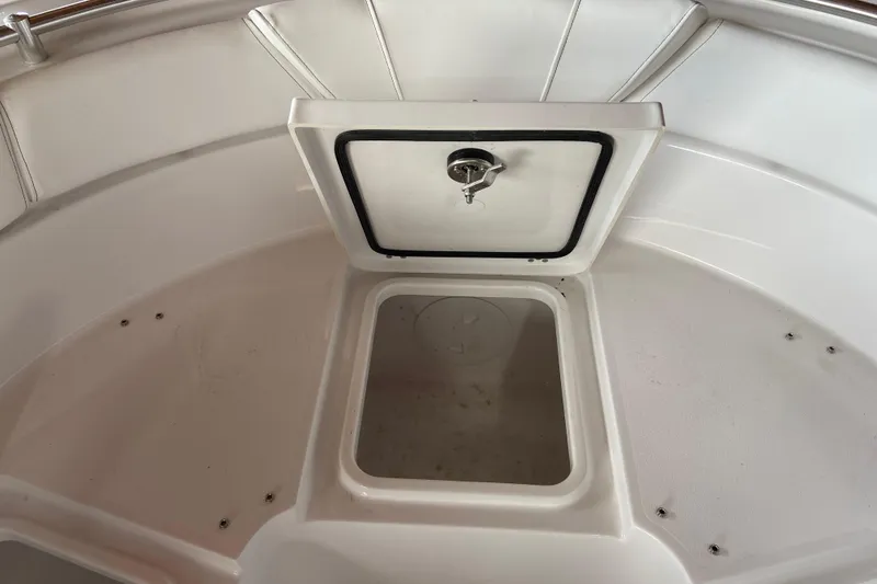 Slide: The Image of 2026 Sportsman Heritage 261 Center Console boat storage compartment. - 49