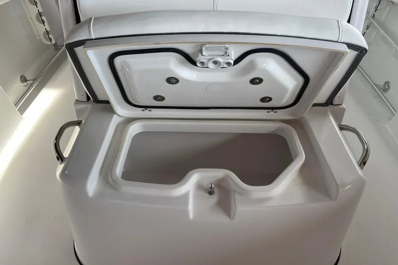 Slide: The Image of Open storage compartment on 2026 Sportsman Heritage 261 Center Console boat. - 53