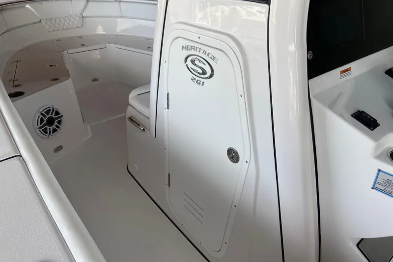 Slide: The Image of 2026 Sportsman Heritage 261 Center Console interior with seating and speaker. - 54