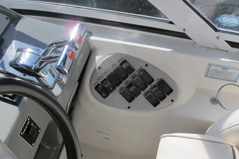 Slide: The Image of Control panel of a 2006 Cruisers Yachts 385 Motoryacht with steering wheel and switches. - 16