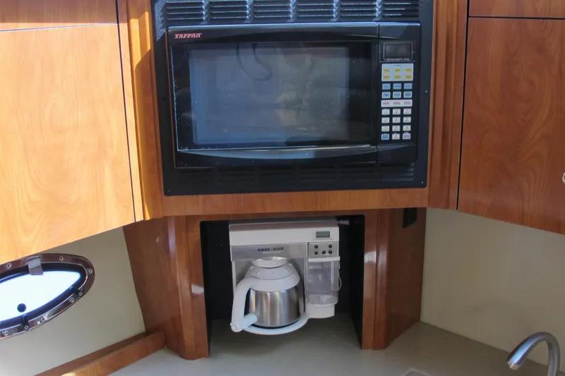 Slide: The Image of 2006 Cruisers Yachts 385 Motoryacht kitchen with microwave and coffee maker. - 28