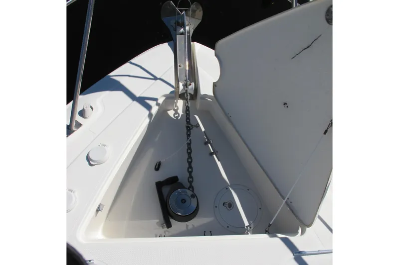 Slide: The Image of 2006 Cruisers Yachts 385 Motoryacht anchor locker with chain and winch. - 62