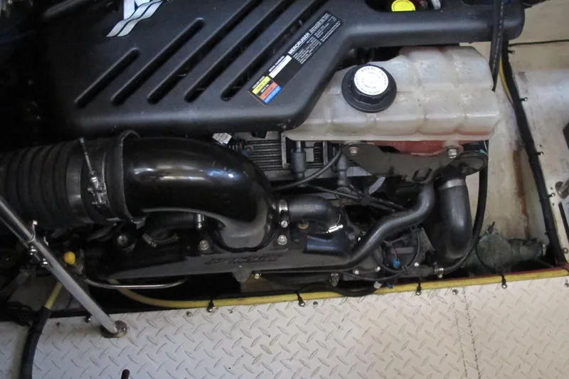 Slide: The Image of Engine compartment of a 2006 Cruisers Yachts 385 Motoryacht, showcasing mechanical components. - 65