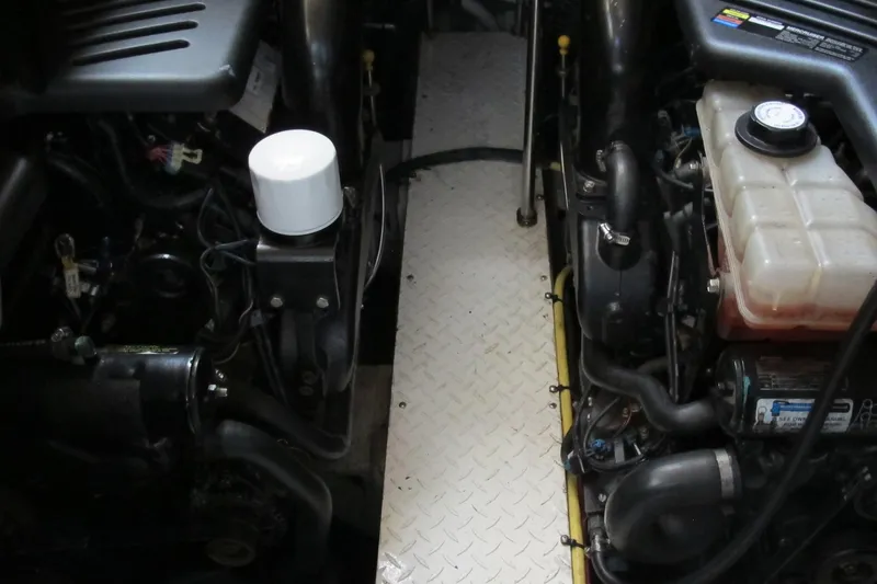 Slide: The Image of Engine compartment of 2006 Cruisers Yachts 385 Motoryacht, showcasing mechanical components. - 67