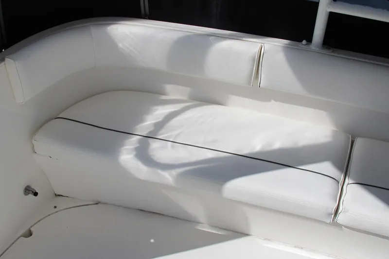 Slide: The Image of White seating area on 2006 Cruisers Yachts 385 Motoryacht, featuring sleek design and comfort. - 8