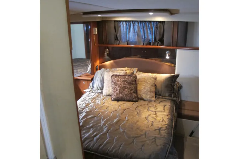 Slide: The Image of Luxurious bedroom interior of 2006 Cruisers Yachts 385 Motoryacht with elegant bedding. - 48