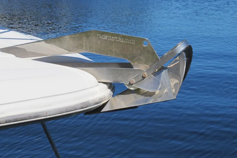 Slide: The Image of 2006 Cruisers Yachts 385 Motoryacht anchor detail over blue water. - 5