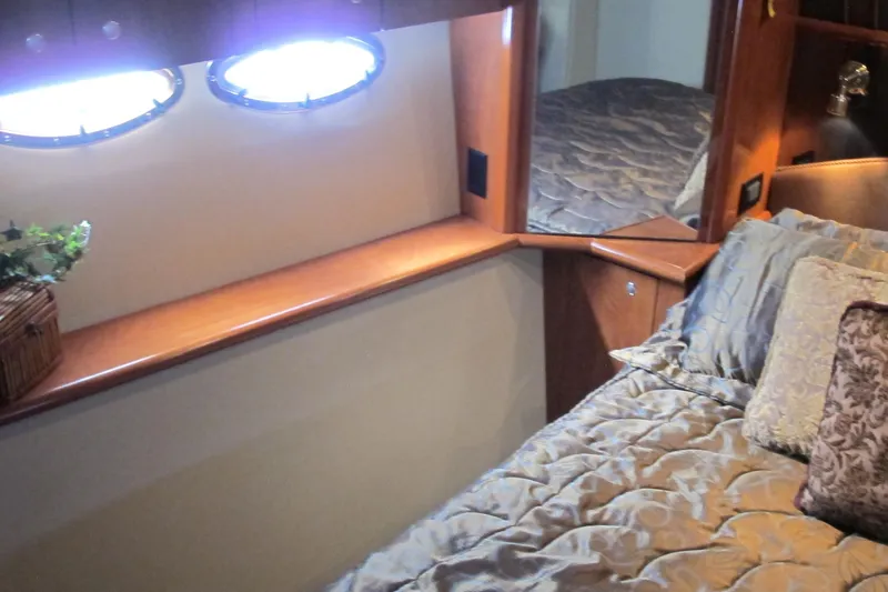 Slide: The Image of Luxurious cabin interior of 2006 Cruisers Yachts 385 Motoryacht with elegant bedding. - 50