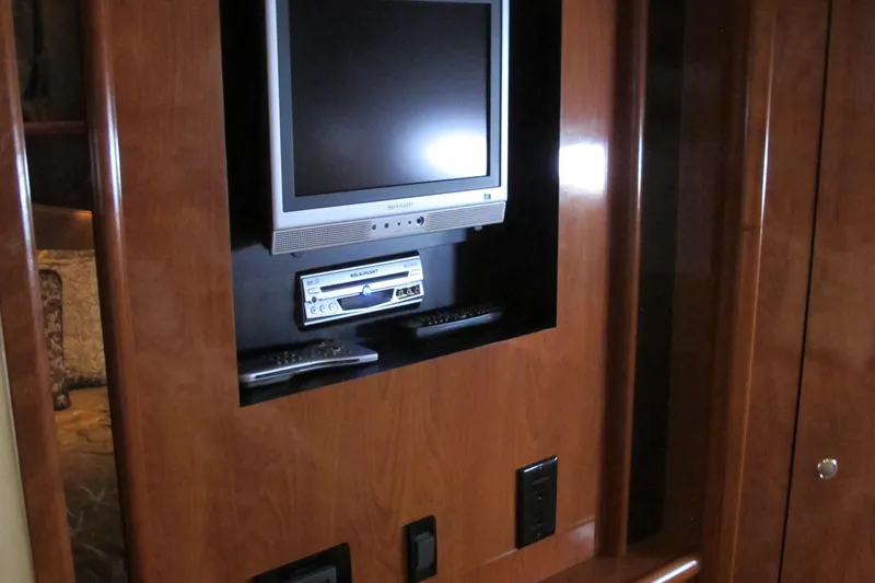Slide: The Image of 2006 Cruisers Yachts 385 Motoryacht interior with built-in TV and entertainment system. - 52